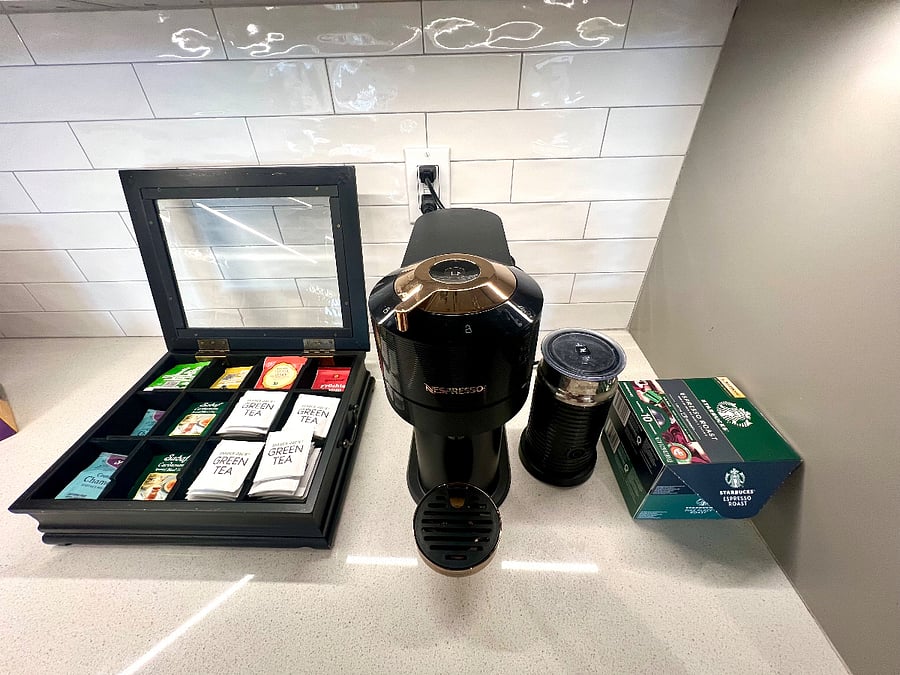 Nespresso machine + Foam Maker + Complimentary Nespresso Capsules + Tea Box with complimentary assortment of teas