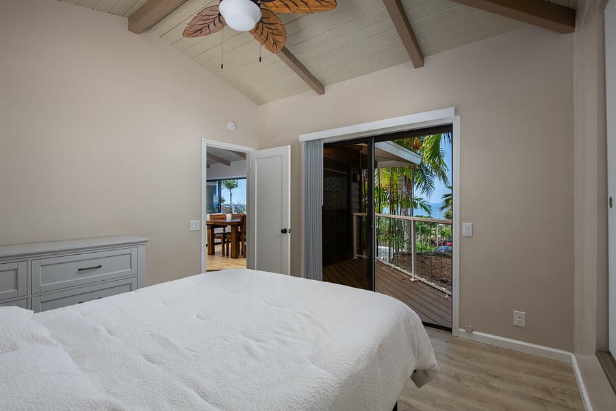 Queen bedroom with access to private lanai and stunning views to wake up to