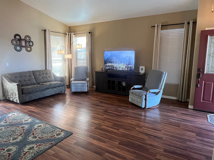 Living room with couch, love seat and 2 reclining rockers