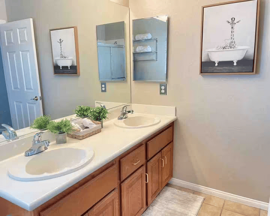 Full Bathroom (Upstairs): Double vanity with large mirror, clean finishes, and plenty of counter spaceideal for shared use.