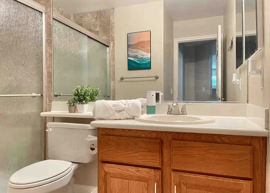 Full Bathroom (Downstairs): Conveniently located with a walk-in shower, perfect for guests or easy access from common areas.