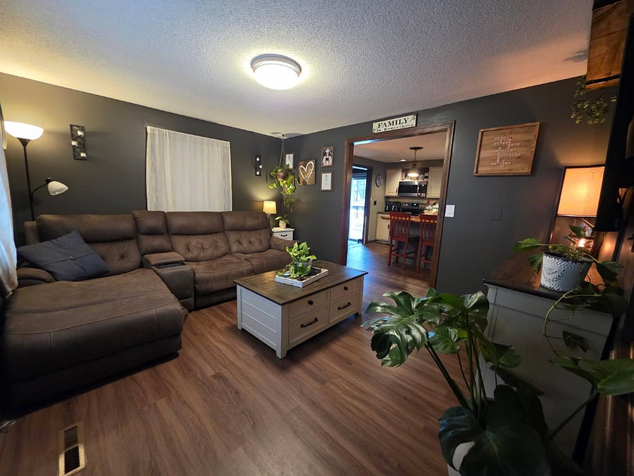 Living area w/55" TV, open to the kitchen