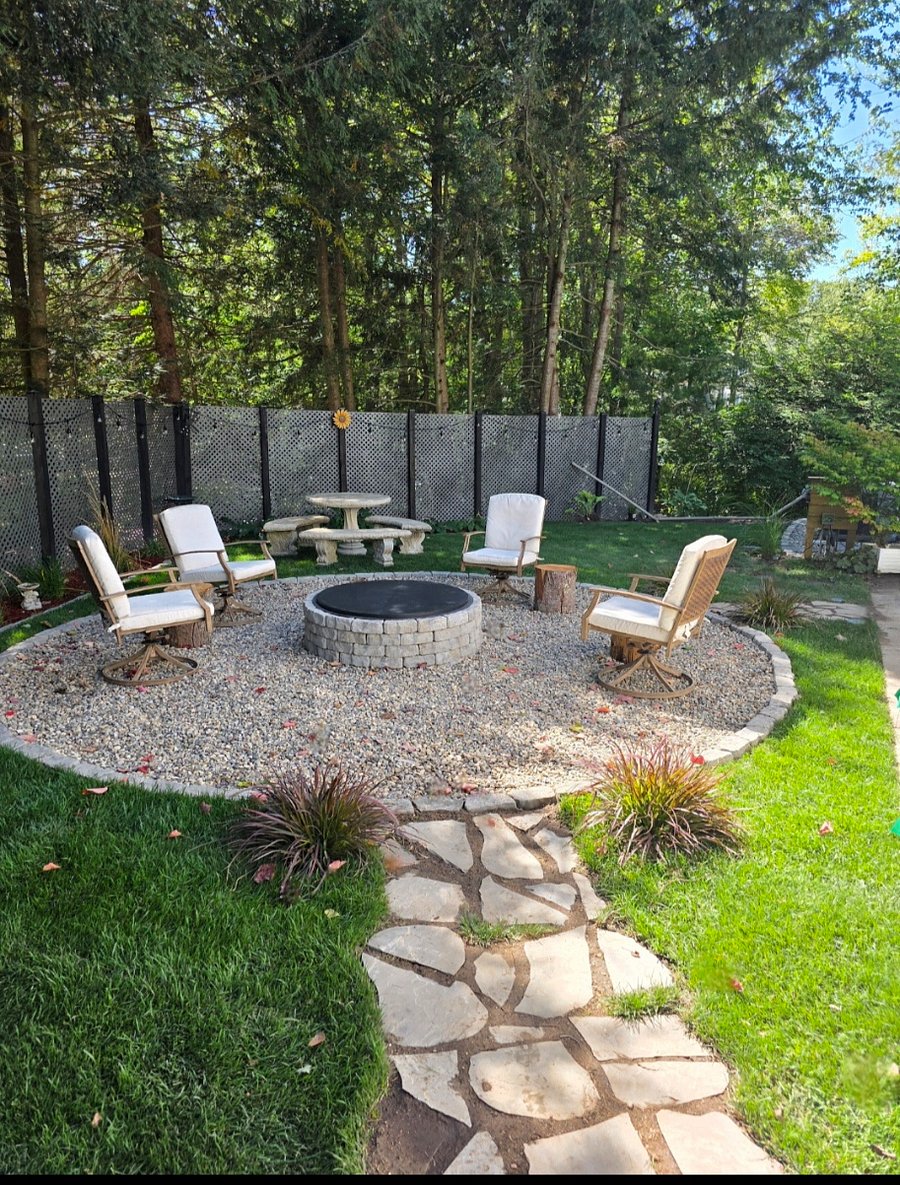 Outdoor Firepit and Projection screen sitting area.