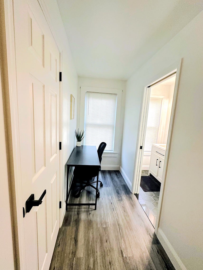 Your private rooms writing desk and chair. Your private bathroom is yo the right. 