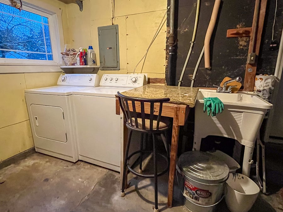 Washer, Dryer, and Utility Sink in garage