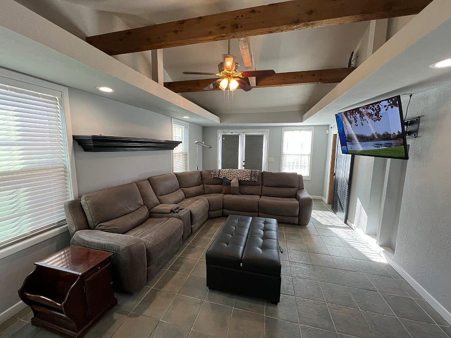 Spacious living with reclining sofa, tv.