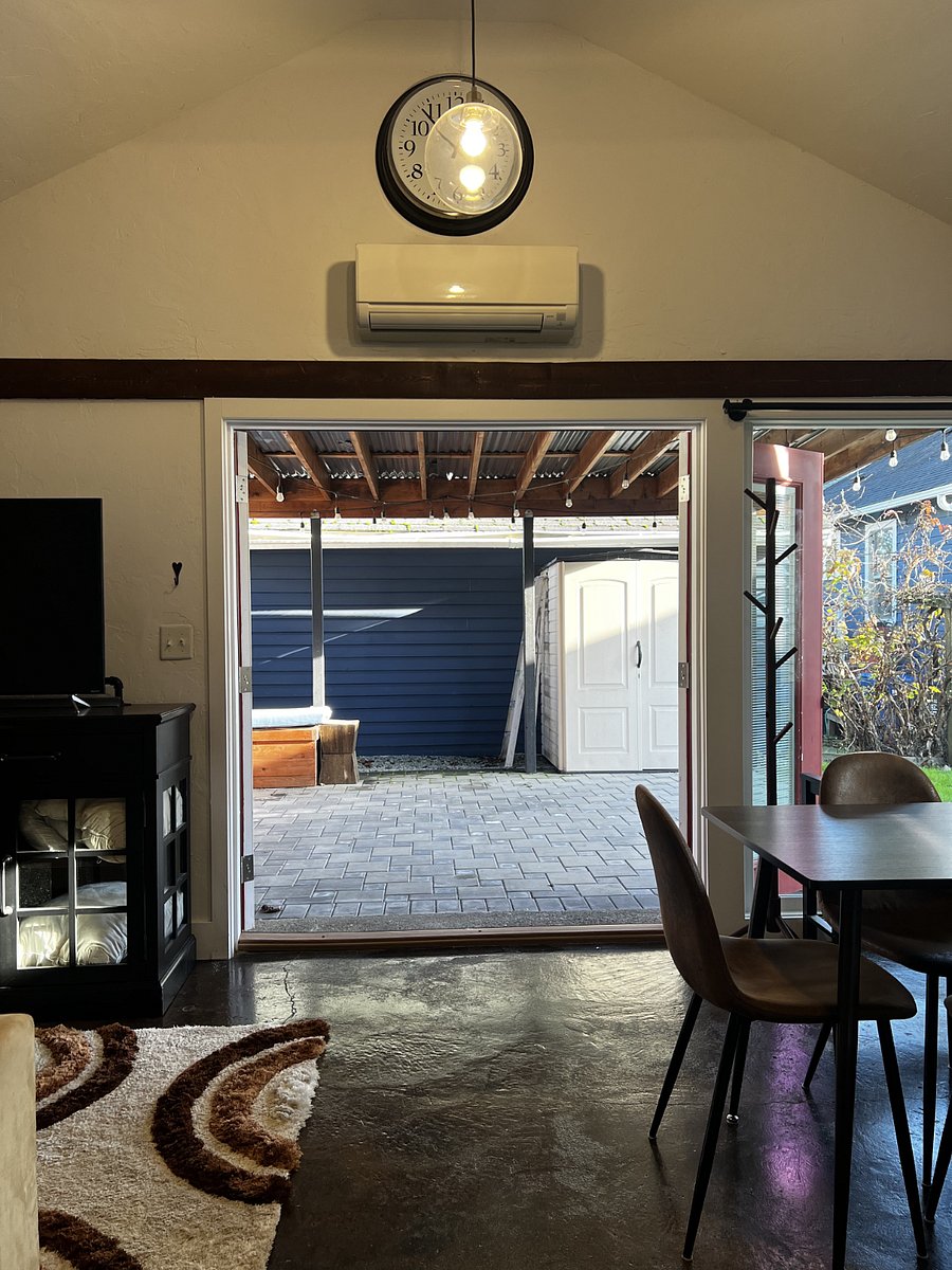 Double French patio doors both open, if desired. Also notice the minisplit unit above the door for both heat AND air conditioning!