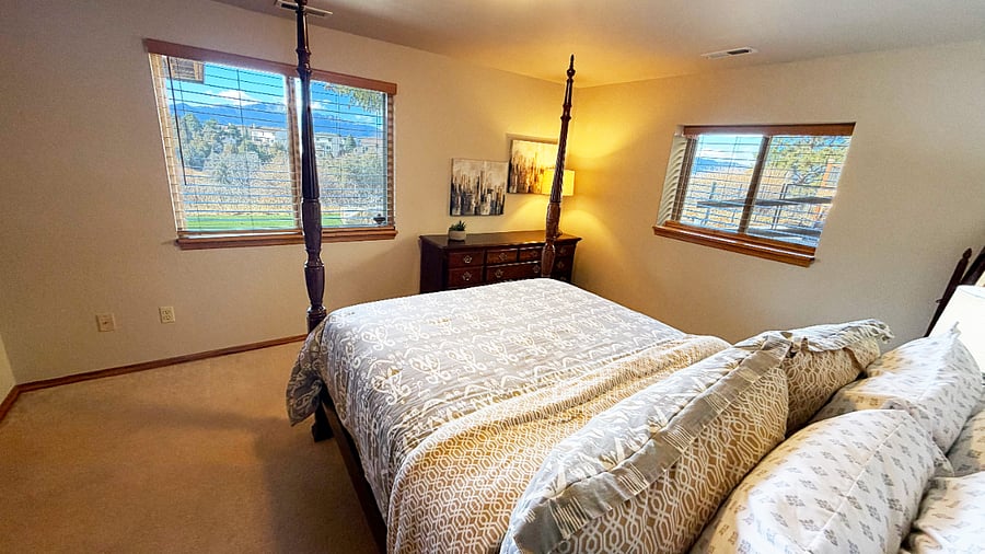 Bedroom 1. Queen bed with wakeup view of Pikes Peak.
