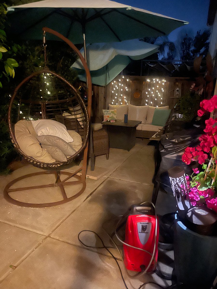 Cozy outdoor living area with firepit and water fountain