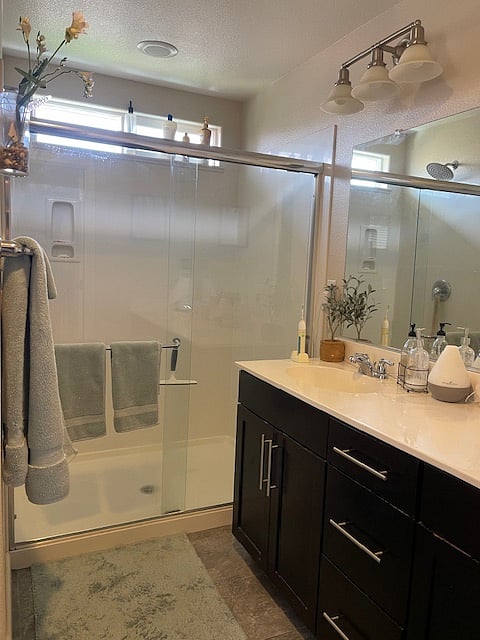 Master Bath, dual vanities, rainfall shower head, lots of storage