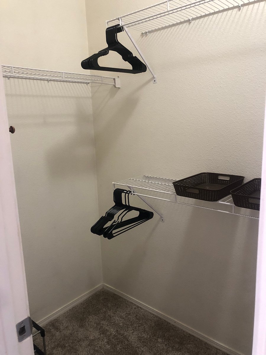 Walk in closet and storage! Laundry hamper, hangers, shoe rack and organizational bins provided for your use.