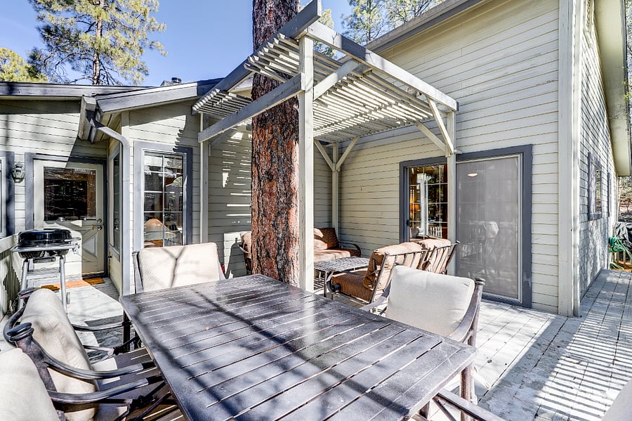 Deck area centered around a pine tree