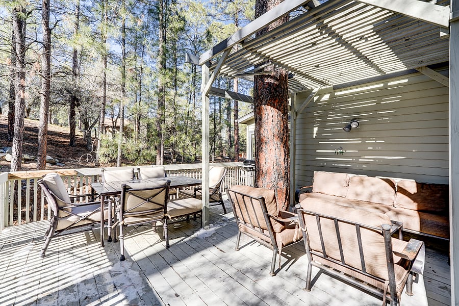 Outdoor deck featuring a conversation seating set and a dining table.