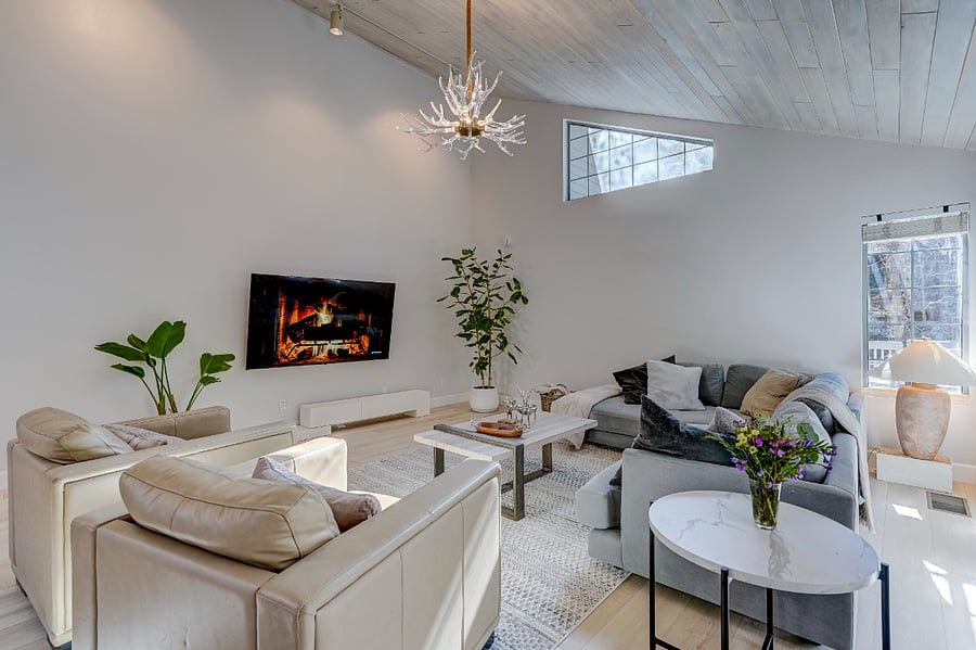 Inviting living room with a comfortable sofa and leather chairs, ideal for relaxing.
