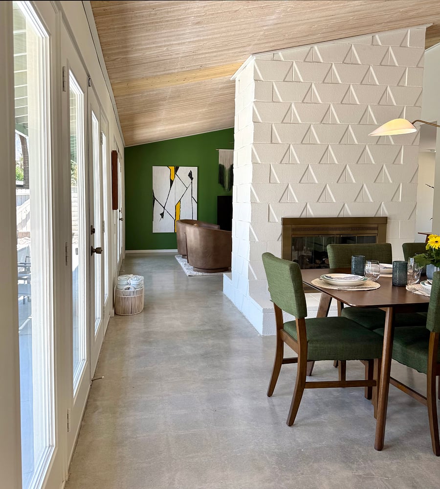 Formal dining area with fireplace.