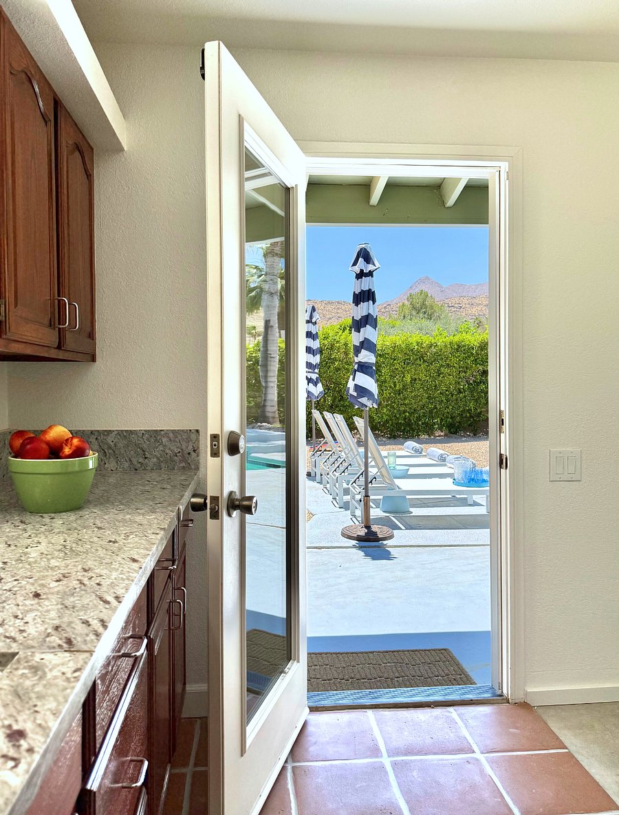 Kitchen opens to backyard and pool deck, and also has a great view.