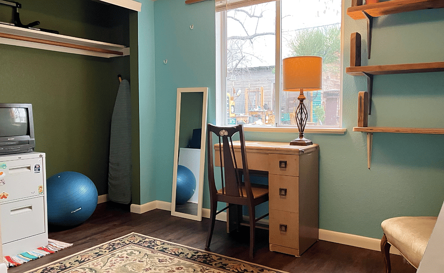 Bedroom 3 with simple exercise equipment and vintage media