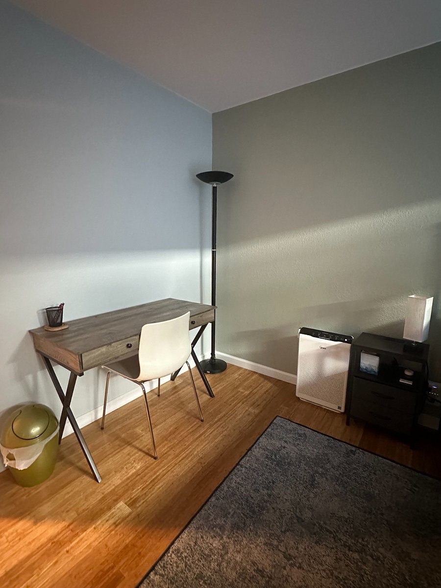 Writing desk, chair, air purifier, and nightstand with lamp