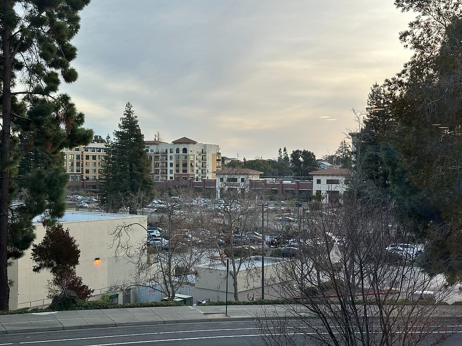 White building is Safeway; plaza has Starbucks, dry cleaners, FedEx, and a Chase branch.

Plaza with City Sports Club gym and restaurants across the main street.