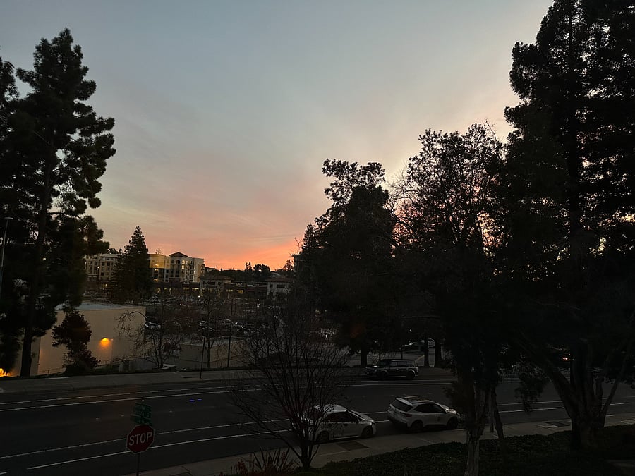 View out the dining room windows of sunset