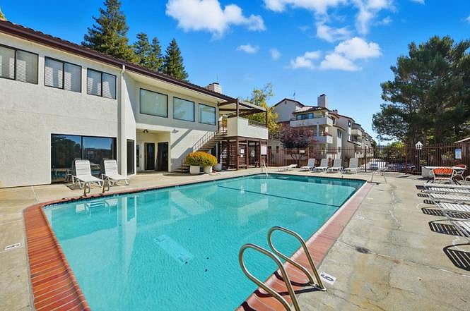 Pool with community gym building behind.