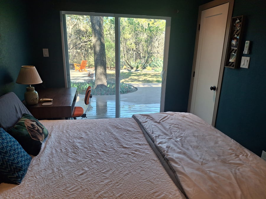 The bedroom opens out directly onto the huge outdoor deck, and it has a view of the nature preserve from your window. There is a black out shade that can pulled down at night.