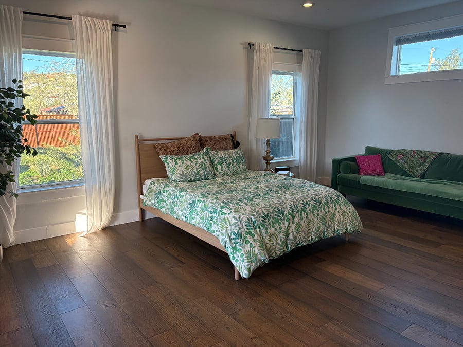 Primary bedroom, opens to deck and ensuite bath with tub and shower and separate wc.