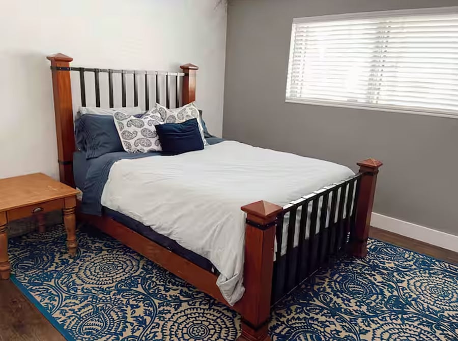 Primary bedroom with private en-suite bathroom, offering added privacy.