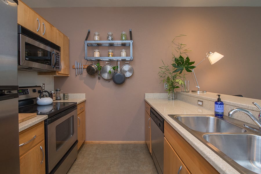 Kitchen stocked with cookware and dining essentials