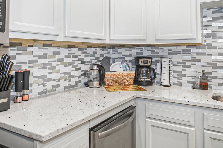 Thoughtfully stocked kitchen counter with coffee station and essentials for everyday convenience.