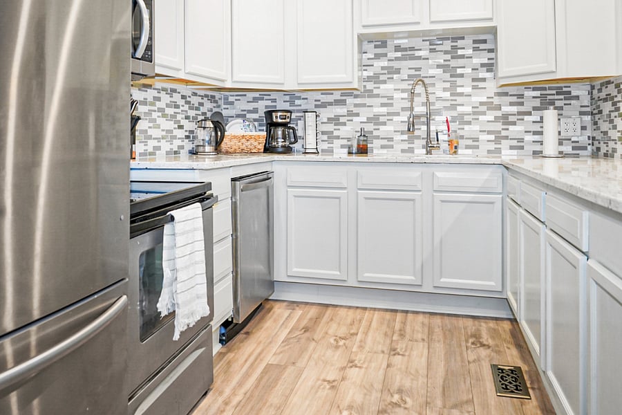 Bright, modern kitchen with stainless steel appliances and plenty of space to cook and gather.