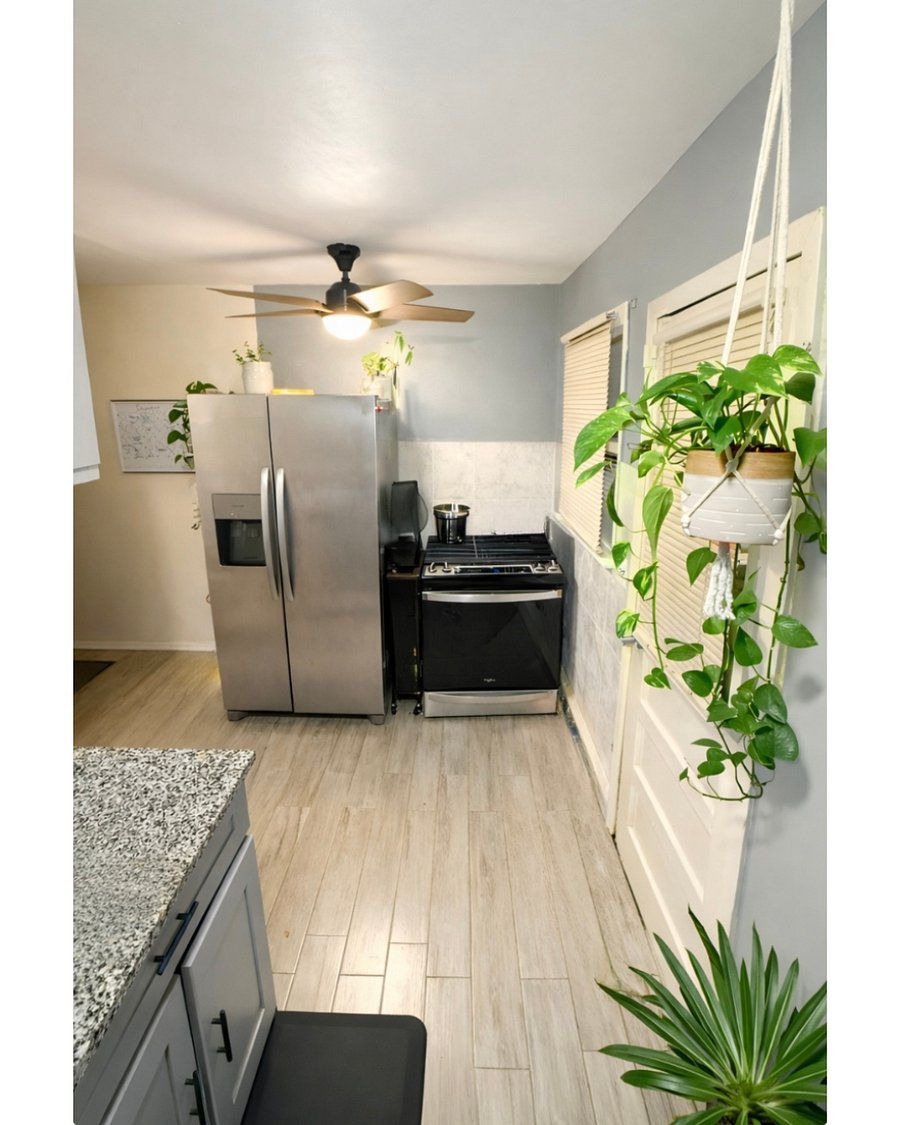 Fully equipped kitchen with stainless steel refrigerator and gas stove. Includes cookware and essentials!