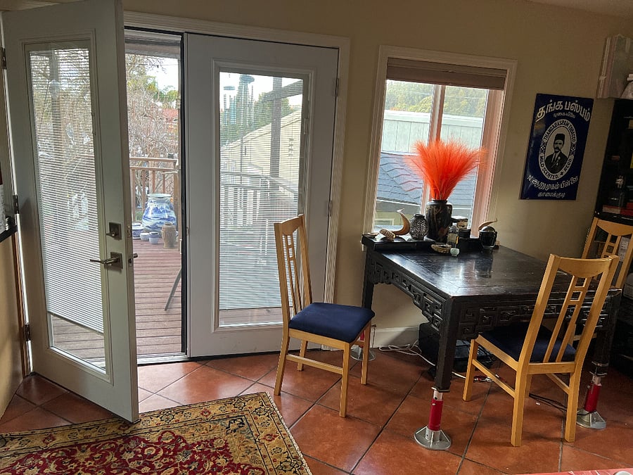 The gracious dining area.  Doors look out over the back garden. 