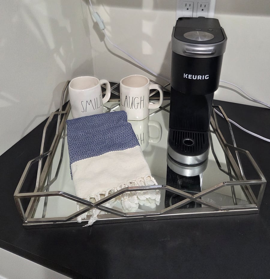 Stocked kitchenette with coffee pot, toaster.oven, microwave, tea kettle.