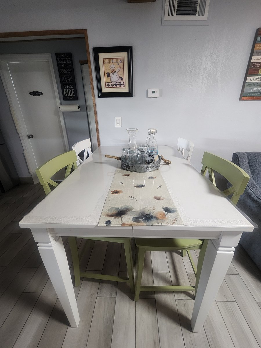 Dining table sits four and can be opened/extended to accommodate more