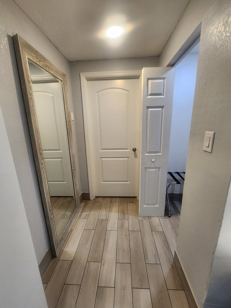 Dressing area with closet and a large life like sz mirror