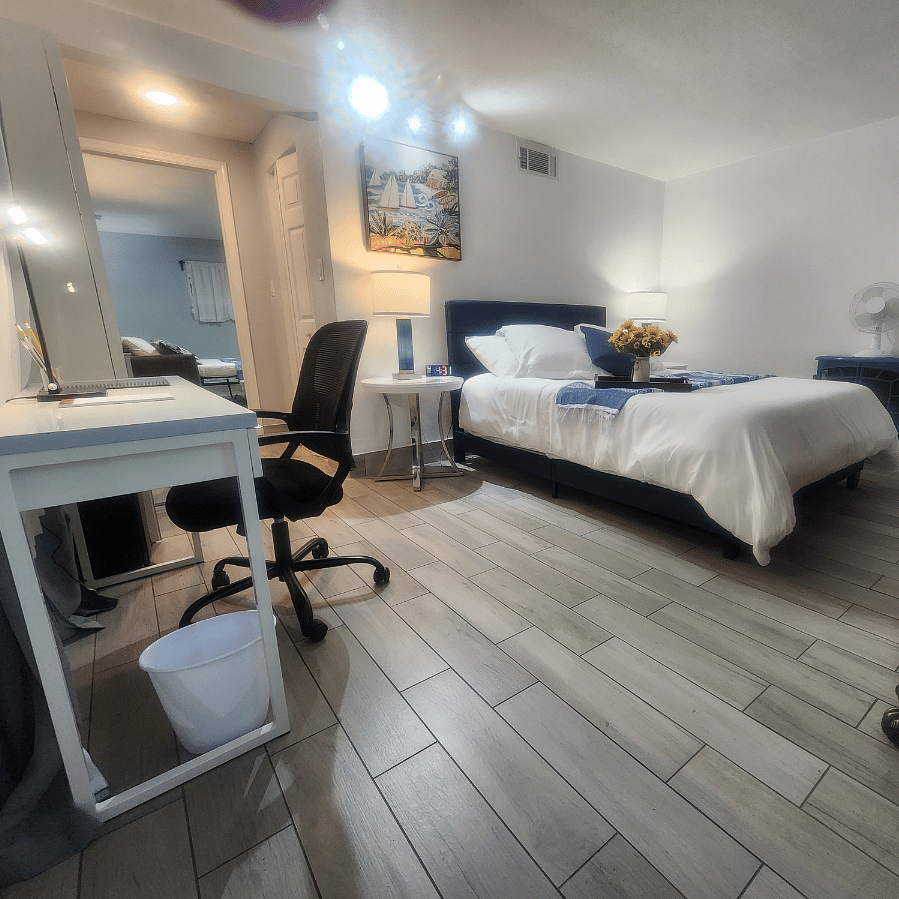 queen bed different view with office space