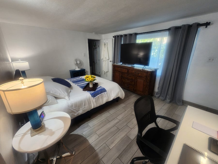 Queen bed with TV different view