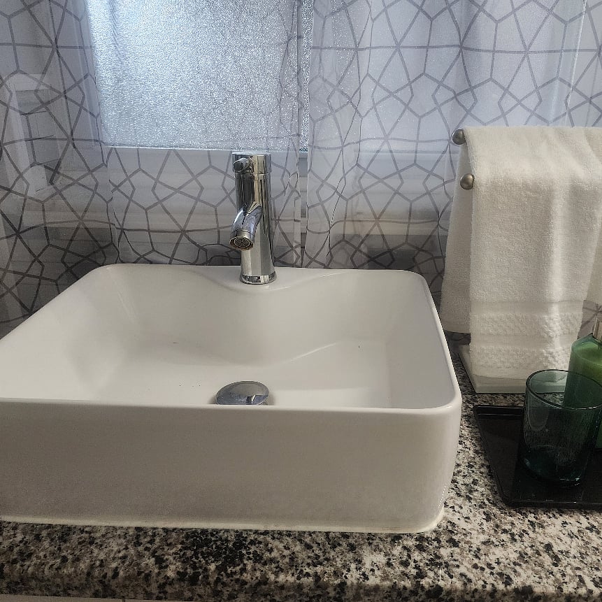 A beautiful deep sink bowl adds a touch of quiet luxury to the bathroom, offering a spalike feel with its smooth design and generous depthperfect for a serene, elevated stay.