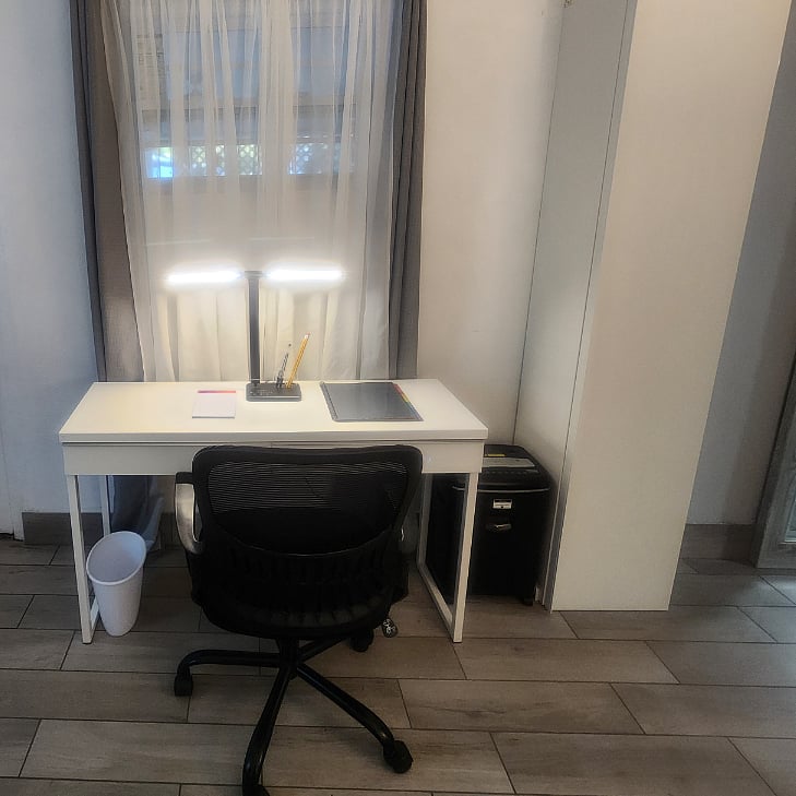Dedicated office space within the bedroom with office storage cabinet