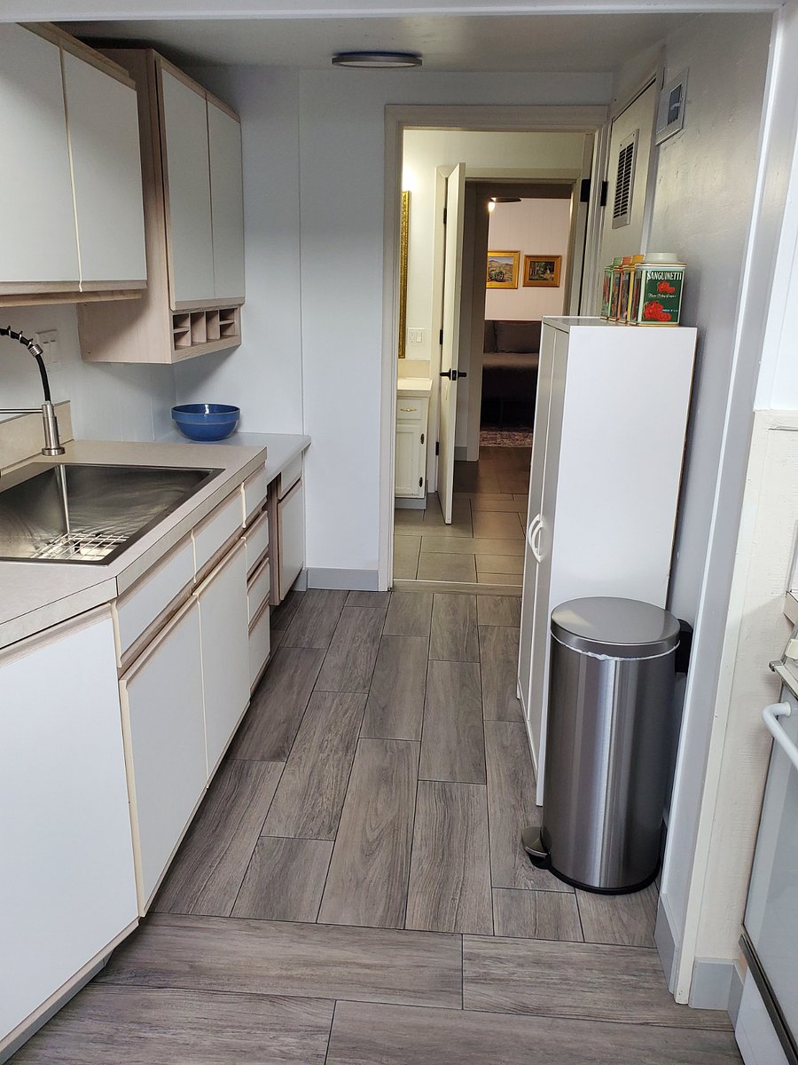 Looking through the bathroom to hallway and bedroom
