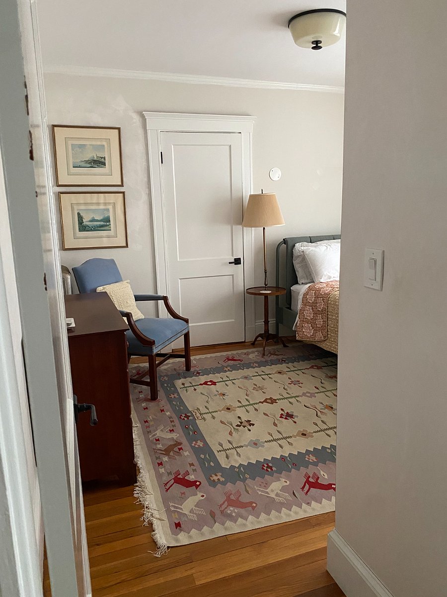 Bedroom with full size bed, dresser, and closets