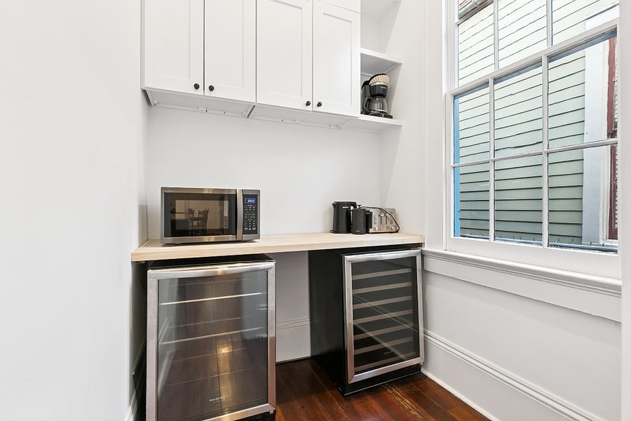 Butlers pantry off of the kitchen with wine fridge and beverage fridge