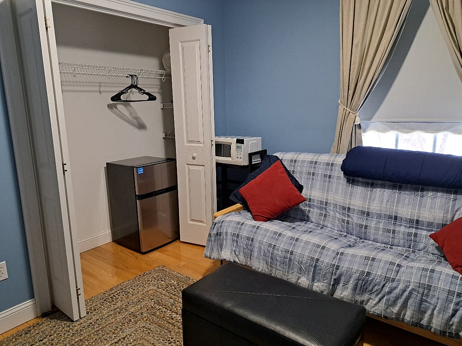 den with mini fridge/freezer and microwave, and fold down futon
