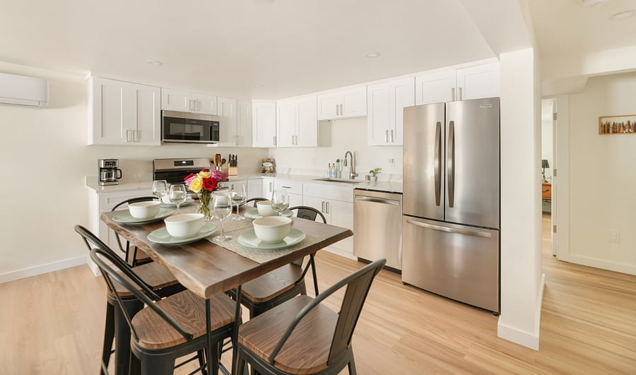- Fully equipped kitchen with stainless steel appliances  
- Spacious dining table set for shared meals and gatherings  
- Bright open-plan design for cooking and enjoying together 