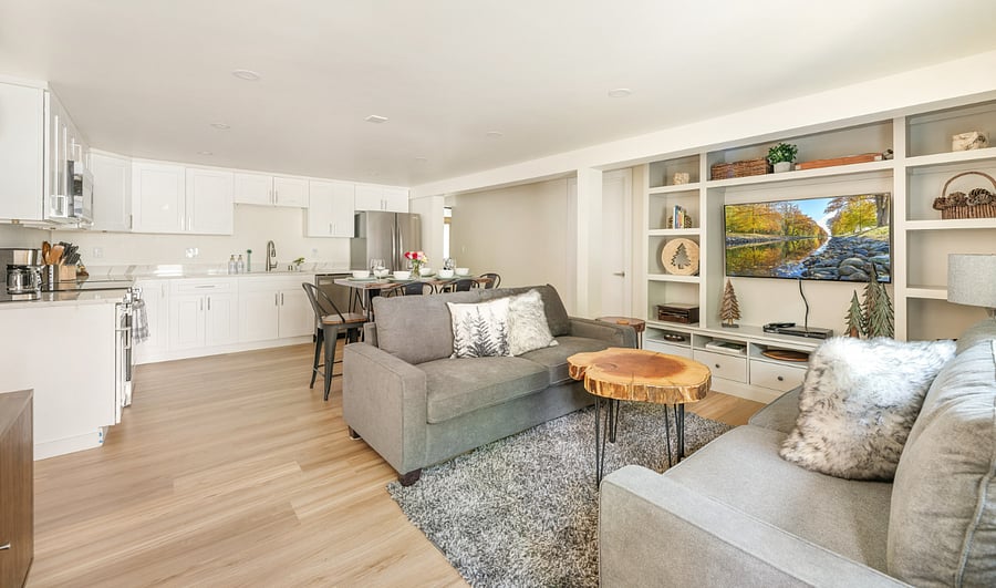 Family Room area with 2 6' sumptuous couches a 60" TV, books, games and extensive DVD collection.
