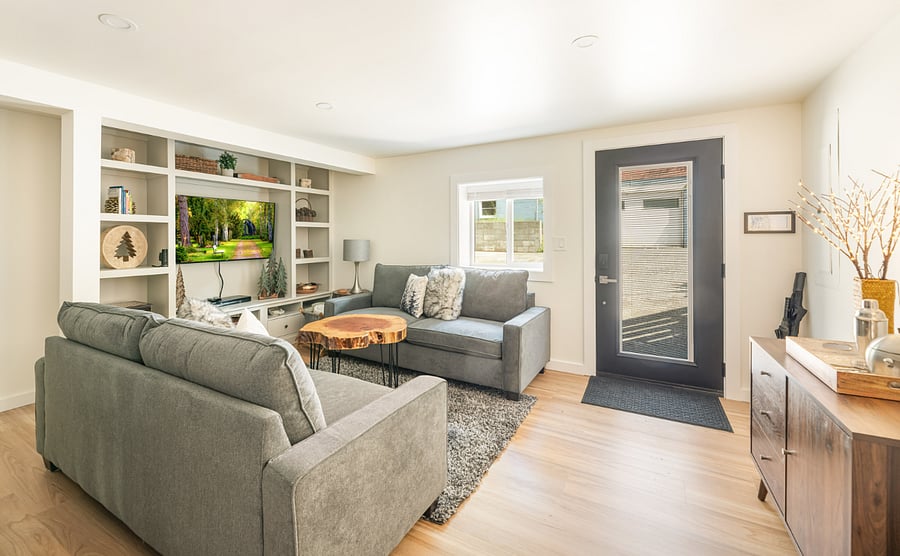 .Bright living room with smart TV and comfortable sofas  
- Modern entryway with natural light and clean open layout  
- Relaxing space to unwind after exploring nearby attractions  
