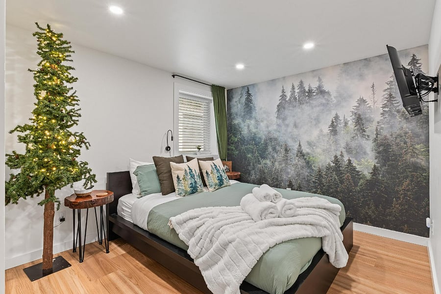 The Mural Room : Forest themed bedroom with mural accent and soft bedding  
- Plush pillows and fresh linens for a comfortable retreat  
- Relaxing space with cozy decor and calming nature tones  
- Smart TV with streaming channels, sound machine/phone charger, USB ports
