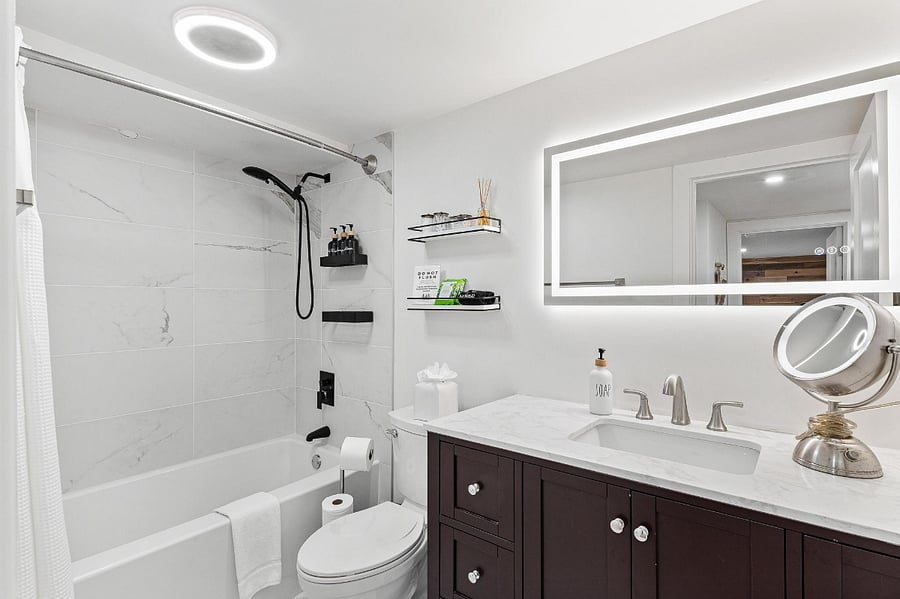 Upscale, luxurious deep tub, detachable shower wand with rain head, backlit LED lights and makeup cloths/magnifying mirror