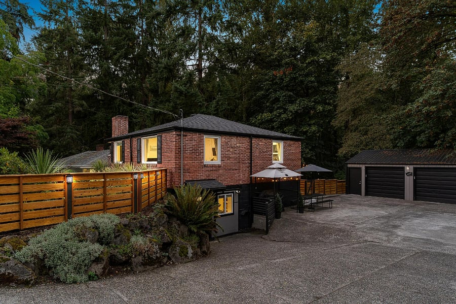 Front door view with BBQ pavilion and parking for 3 cars